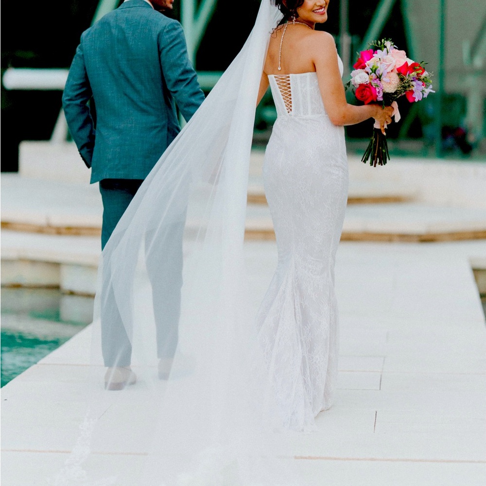 Gorgeous, lace, Lia Stubella corset, mermaid white wedding dress with train.
